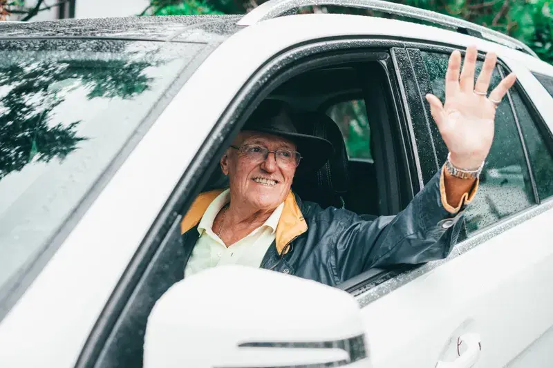 Senior man driving comfortably